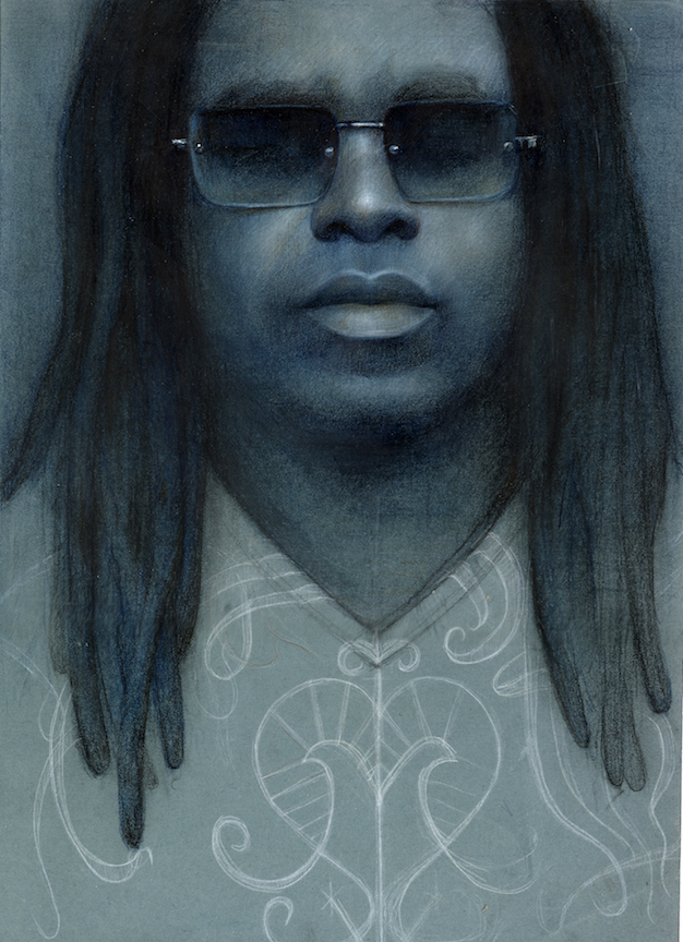 Portrait of a Black man with dreadlocks wearing sunglasses